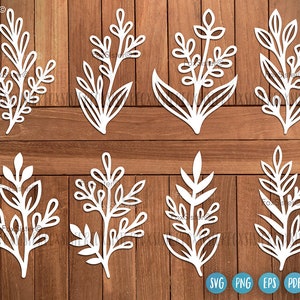 May include: Set of eight white, stylised floral designs, ideal for crafting projects. Each design features a unique arrangement of leaves and stems.