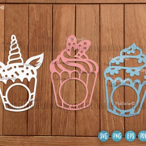 May include: Three decorative cupcake cutouts in white, pink, and blue, each with a unique design. The white cupcake features a unicorn horn, while the pink one has a bow. The blue cupcake has a decorative top. The image includes SVG, PNG, EPS, and PDF icons.
