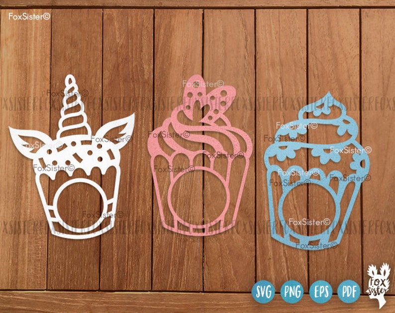 May include: Three decorative cupcake cutouts in white, pink, and blue, each with a unique design. The white cupcake features a unicorn horn, while the pink one has a bow. The blue cupcake has a decorative top. The image includes SVG, PNG, EPS, and PDF icons.