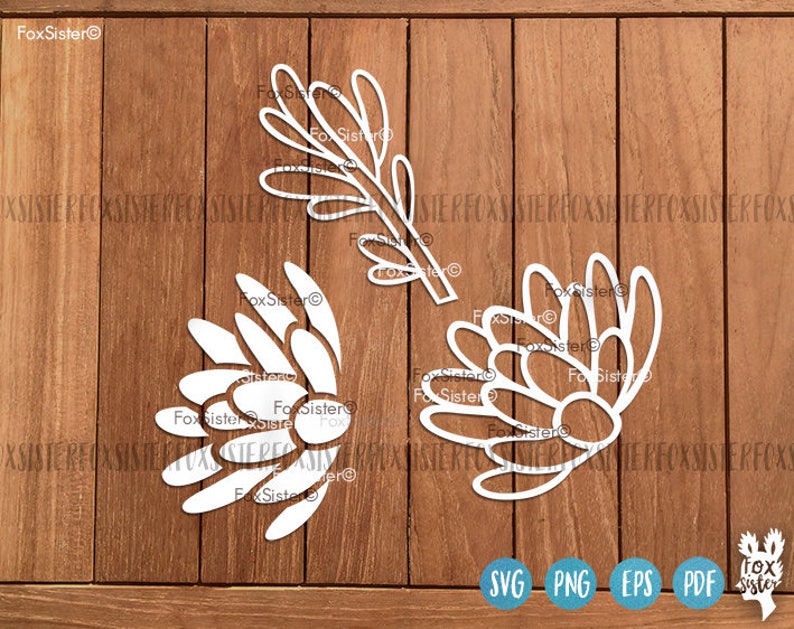 May include: White silhouette cutouts of a protea flower and a branch with leaves. The cutouts are on a wood background. The text "FoxSister" is in the top left corner of the image.