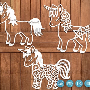 Könnte beinhalten: Drei weiße Unicorn-Silhouetten-Schnittdateien mit filigranen Designs. Die Einhörner sind in verschiedenen Posen, eines steht, eines geht und eines liegt. Die Designs sind perfekt für Bastelprojekte wie Papierschneiden, Scrapbooking und Kartenherstellung.
