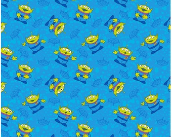 Pixar and Disney’s fabric by the yard. Toy Story Alien Family. 100% cotton Fabric.
