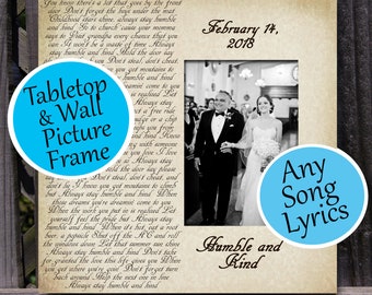 May include: A white picture frame with a black and white photo of a couple getting married. The frame has a beige background with a handwritten quote about being humble and kind. The text "February 14, 2018" is also visible. The frame is labeled "Tabletop & Wall Picture Frame".