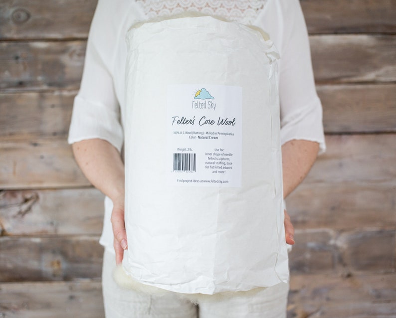 May include: A white bag of Felted Sky Felter's Core Wool, 100% US Wool, Natural Cream, 2 lb.  The bag has a label with the company logo and information about the product.  Find project ideas at www.feltedsky.com.