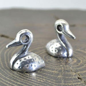 Colgante de pato celta de plata de ley