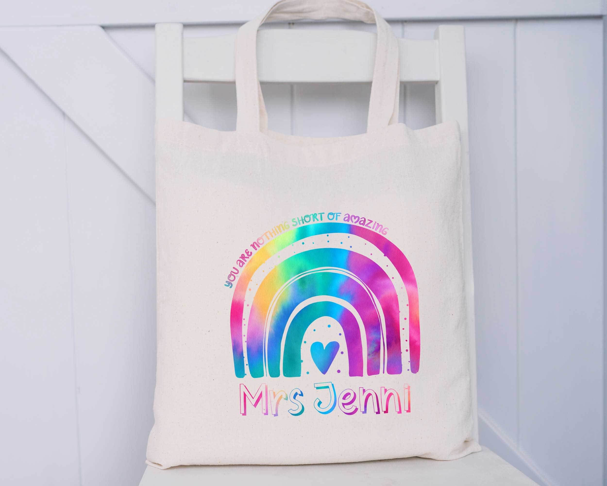 A Person Holding a Rainbow Tote Bag · Free Stock Photo