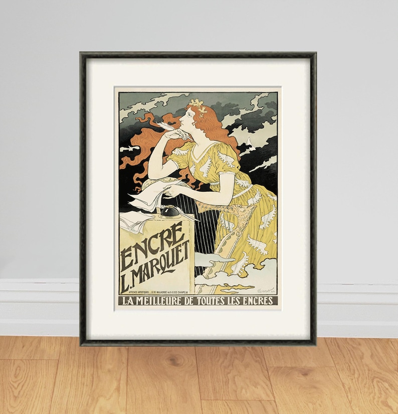 May include: A vintage poster advertising Encre L'Marquet ink. The poster features a woman with red hair writing with a quill pen. The text on the poster reads "Encre L'Marquet" and "La Meilleure de Toutes les Encres".