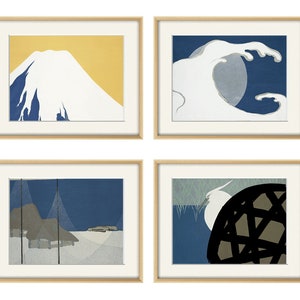 May include: Four framed prints with Japanese-inspired designs. The top left print features a white mountain with a yellow background. The top right print features a white wave crashing against a blue background. The bottom left print features a blue and gray landscape with a white background. The bottom right print features a white bird with a black and gray background.
