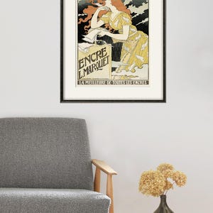 May include: A vintage poster advertising "Encre L'Marquet" ink. The poster features a woman with red hair writing with a quill pen. The text on the poster reads "La Meilleure de Toutes Les Encres", which translates to "The Best of All Inks".