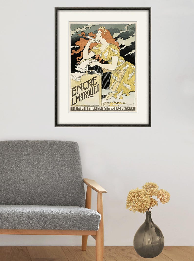 May include: A vintage poster advertising "Encre L'Marquet" ink. The poster features a woman with red hair writing with a quill pen. The text on the poster reads "La Meilleure de Toutes Les Encres", which translates to "The Best of All Inks".