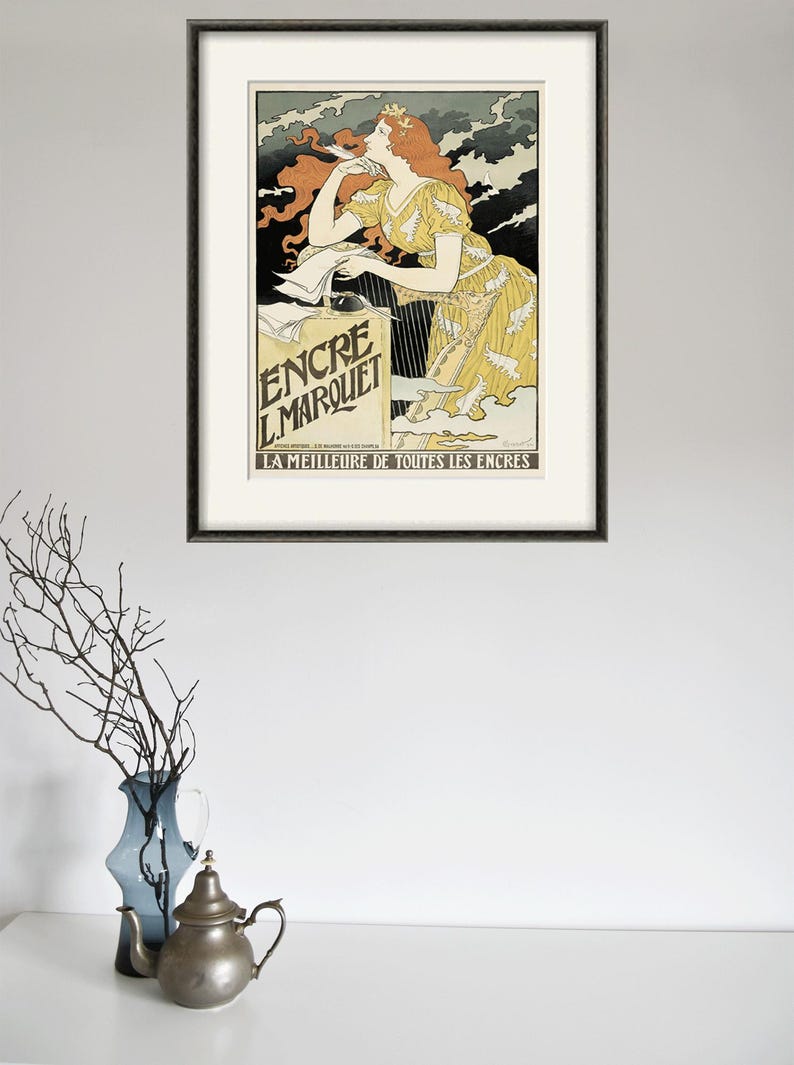 May include: A vintage poster advertising "Encre L.Marquet" ink. The poster features a woman in a yellow dress with flowing red hair, holding a pen and writing on a piece of paper. The text "LA MEILLEURE DE TOUTES LES ENCRES" is at the bottom of the poster.