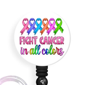 May include: A white badge reel with a round button featuring a rainbow of awareness ribbons and the text "Fight Cancer in all colors".