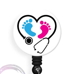 May include: A white badge reel with a black retractable cord. The badge holder features a white background with a black heart outline. Inside the heart are two footprints, one blue and one pink, and a black stethoscope.
