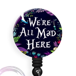 We're All Mad - Colorful - 1.5 inch Button - Available in a Pin, Magnet or Badge Holder Reel - Flat Rate Shipping!