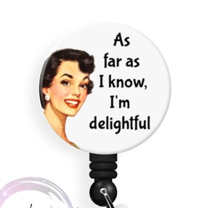 May include: A white badge reel with a black retractable cord and a clear plastic clip. The badge reel has a retro image of a woman and the text "As far as I know, I'm delightful."