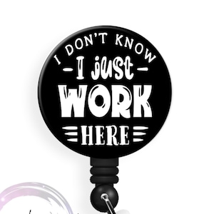 May include: Black and white badge reel with a round, black button that reads "I don't know - I just work here".