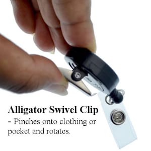 May include: A black alligator swivel clip with a silver swivel. The clip is attached to a clear plastic badge holder. The text "Alligator Swivel Clip" and "Pinches onto clothing or pocket and rotates." is visible below the clip.