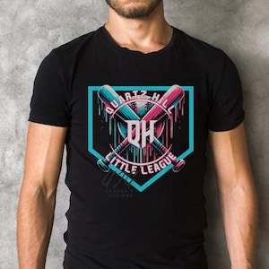 May include: Black t-shirt with a graphic of a baseball diamond with two crossed bats and a baseball. The text "Quartz Hill Little League" is written around the diamond. The letters "QH" are in a circle in the center of the diamond.