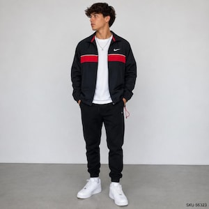 May include: A black zip-up track jacket with a white Nike swoosh logo and a horizontal red stripe across the chest, worn over a plain white t-shirt with black sweatpants and white sneakers. The outfit features a clean, athletic design.