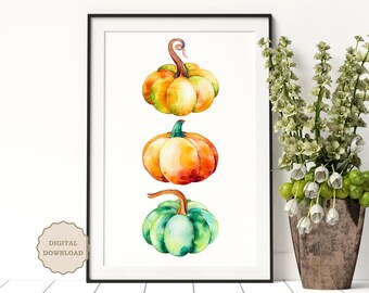 May include: A digital print of three watercolor pumpkins stacked vertically. The top pumpkin is yellow and green, the middle pumpkin is orange and red, and the bottom pumpkin is green and blue.