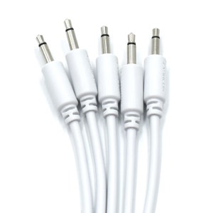 May include: Five white audio cables with 1/4 inch male connectors. The cables are bundled together and the connectors are facing the camera.
