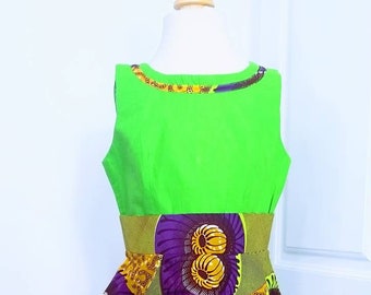 African print girls dress in green, purple and mustard colours.