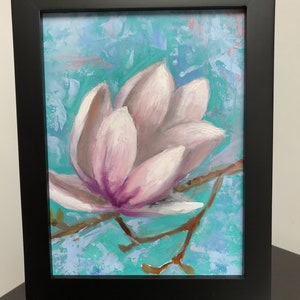 May include: A framed painting of a single pink magnolia flower with a light blue and green background.