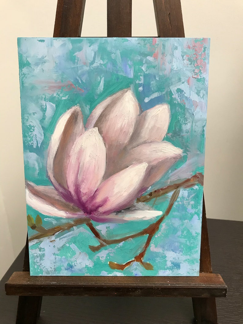 May include: A painting of a single pink magnolia flower with a light blue and green background.