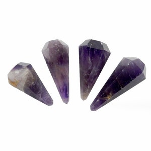 May include: Four amethyst crystal points, each with a pointed tip and a faceted, hexagonal base. The crystals are a deep purple color with some lighter areas.