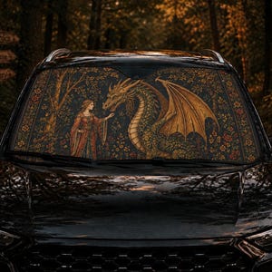 May include: A black car windshield sunshade featuring a detailed illustration of a person in medieval-style clothing standing before a large, winged dragon. The scene is set against a dark, floral-patterned background with trees and foliage.