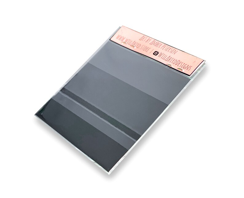 May include: A grey and white striped acrylic sheet with a pink label that reads "Art by Jaber Petersen | www.willardstore | @willardartdesigns".