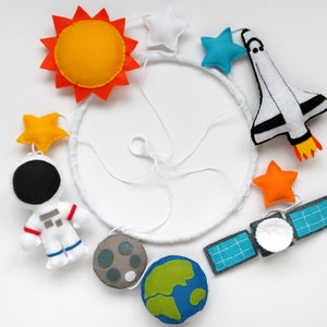 Space baby mobile with an astronaut, Space Shuttle and satellite, handmade from felt