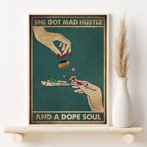 May include: A vintage-style poster with a green background featuring a hand rolling a joint with a flower on top. The text reads "She got mad hustle and a dope soul."