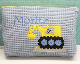 Toiletry bag, diaper bag with desired name excavator