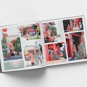 May include: A photo album with a red and gold theme. The album is open to a page with several photos of a person wearing a red and gold outfit in front of a red and gold temple. The album has a decorative border with a pattern of red and gold lanterns. The text "moment" is printed on the right page.