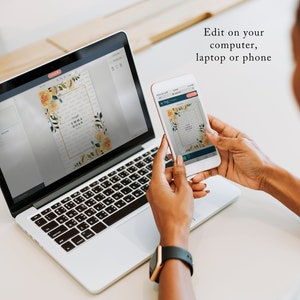 May include: A person is editing a wedding invitation on a laptop and a phone. The invitation features a floral design with yellow and orange flowers and the text "Emma & John".