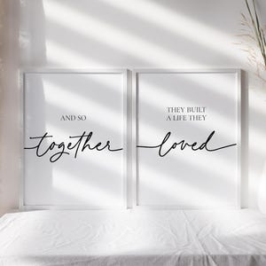 May include: Two white framed prints with black text. The left print says "And so together". The right print says "They built a life they loved".