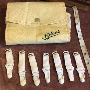 Vintage &#39;Purse&#39; with pockets for Storing Nylon Stockings with Suspender Clips. (Fair Condition)