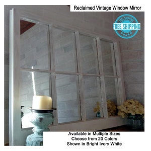 May include: A white, reclaimed vintage window mirror with multiple panes. The mirror is available in multiple sizes and 20 colors. The mirror is shown in bright ivory white.