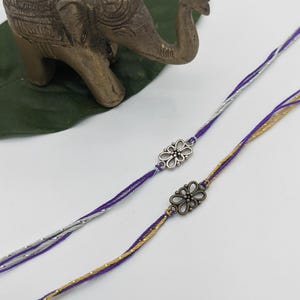 Purple Silver Gold Flower Rakhis