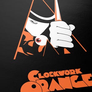 May include: A black and orange poster for the movie "A Clockwork Orange" by Stanley Kubrick. The poster features a stylized image of a man holding a knife, with a large orange eye visible in the background.