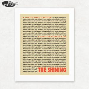 May include: A yellow poster with the title "The Shining" in red text. The poster features a quote from the novel and film, "All work and no play makes Jack a dull boy." repeated multiple times. The quote is attributed to Stanley Kubrick and Stephen King.