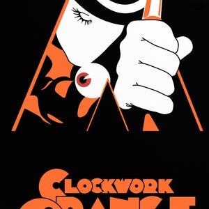 May include: A black and orange poster with the text "CLOCKWORK ORANGE" in large, bold, orange letters. The poster features a stylized image of a person's hand holding a weapon, with a large eye in the background.