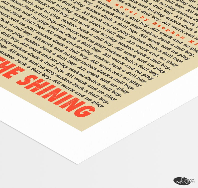 May include: A vintage-style poster for the movie "The Shining" by Stephen King. The poster features the movie title in red text with a white background. The text "All work and no play makes Jack a dull boy" is repeated multiple times in black text.