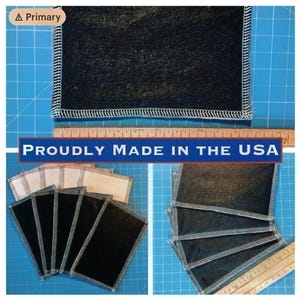 May include: Several dark gray fabric squares with white stitching are displayed. The text "PROUDLY MADE IN THE USA" is visible. A wooden ruler is also present, indicating measurements.