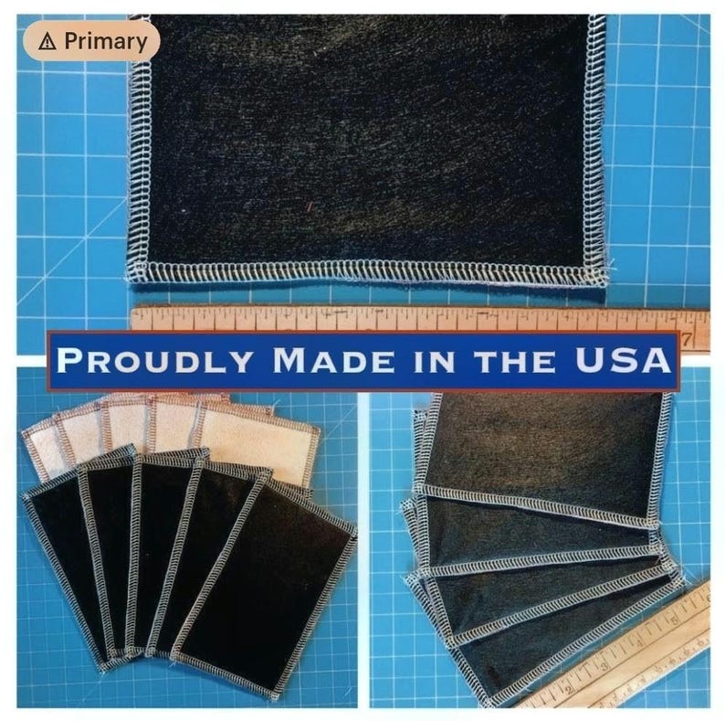 May include: Several dark gray fabric squares with white stitching are displayed. The text "PROUDLY MADE IN THE USA" is visible. A wooden ruler is also present, indicating measurements.
