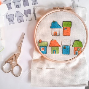 progress photos of embroidered modern cross stitch coloured cottages cross stitch