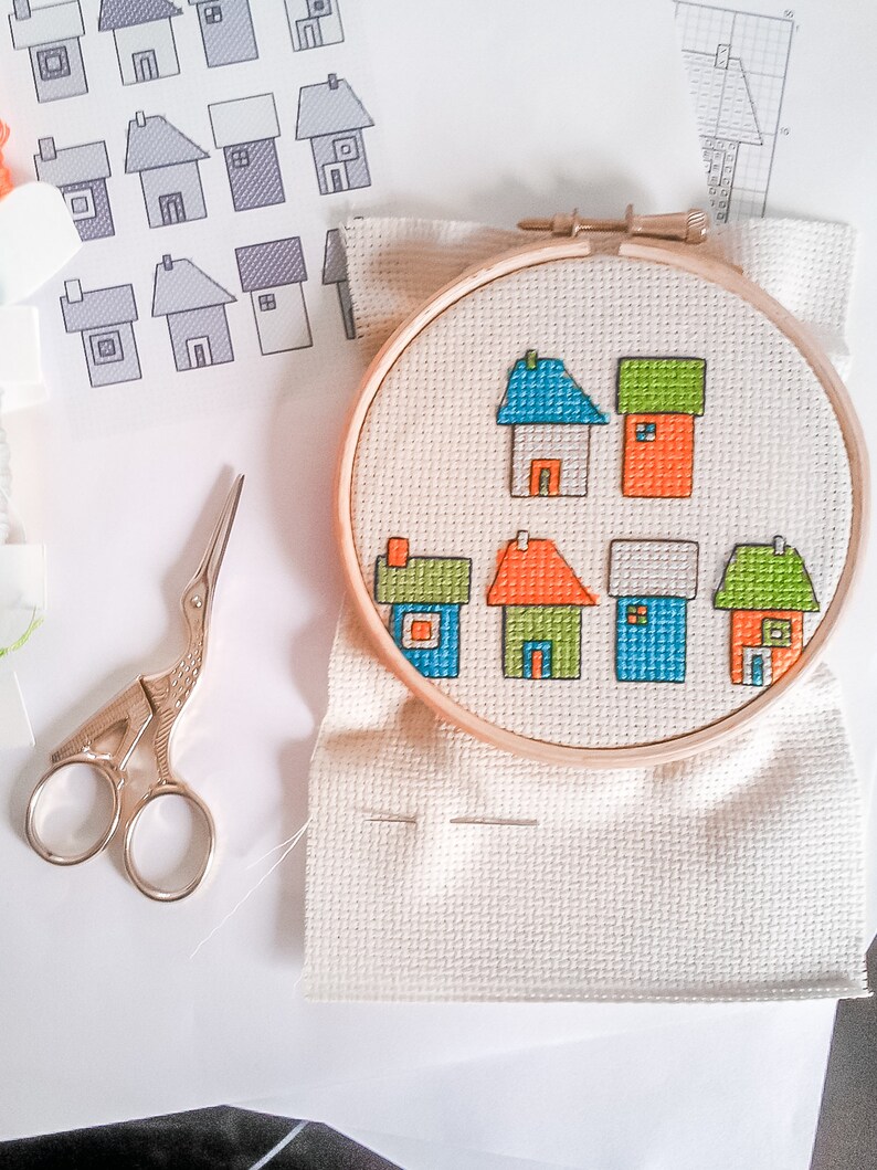 progress photos of embroidered modern cross stitch coloured cottages cross stitch