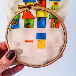 progress photos of embroidered modern cross stitch coloured cottages cross stitch