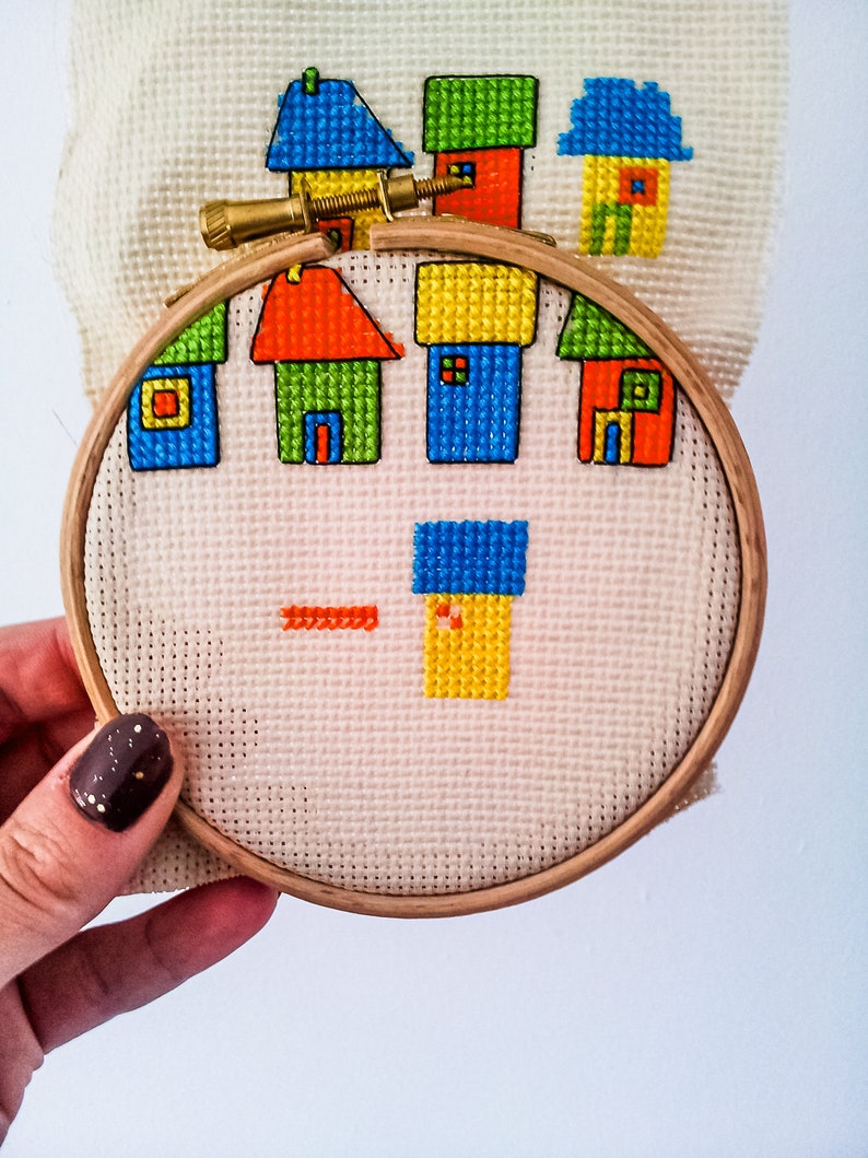 progress photos of embroidered modern cross stitch coloured cottages cross stitch